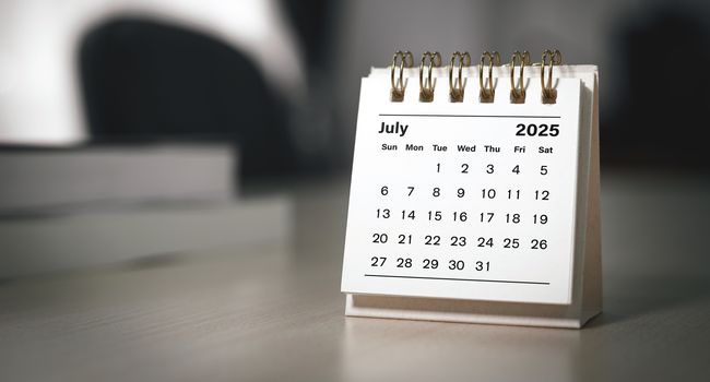 Calendar page July of the year 2025 white color in meeting room in office.